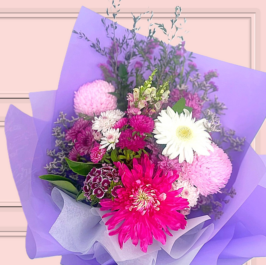 Bouquet of bright flowers wrapped in purple paper - same day flower delivery Sydney