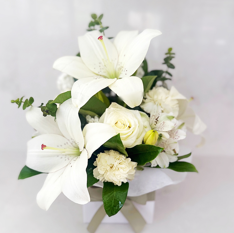 Sympathy flower arrangement of white lilies, roses and carnations | same day flower delivery Hills District