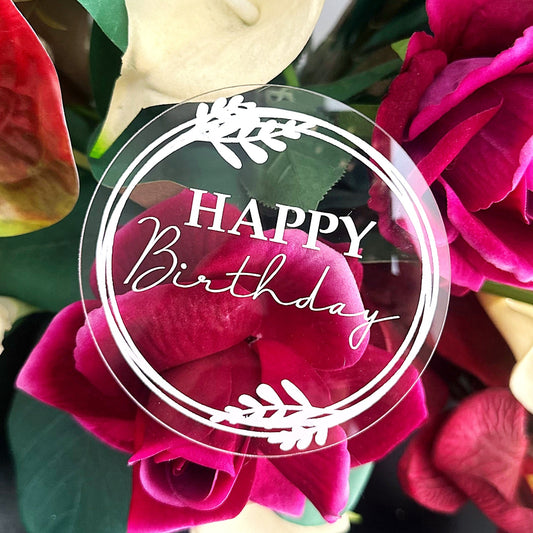 Acrylic round plaque with happy birthday message added to flower arrangement.