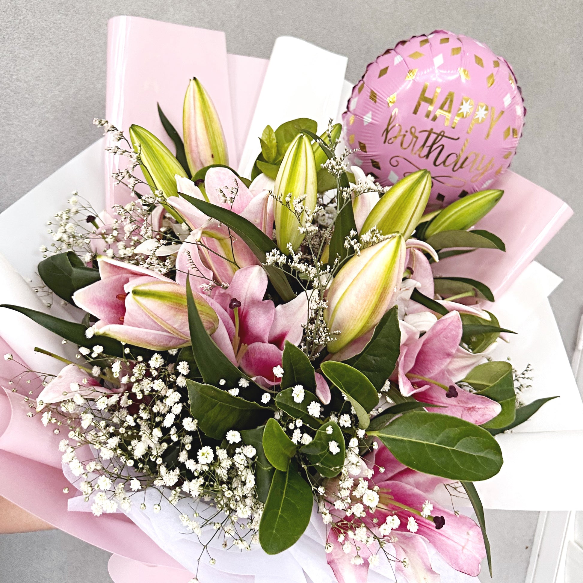 Bouquet of pink lilies with a 'Happy Birthday' balloon same day flower delivery Kellyville