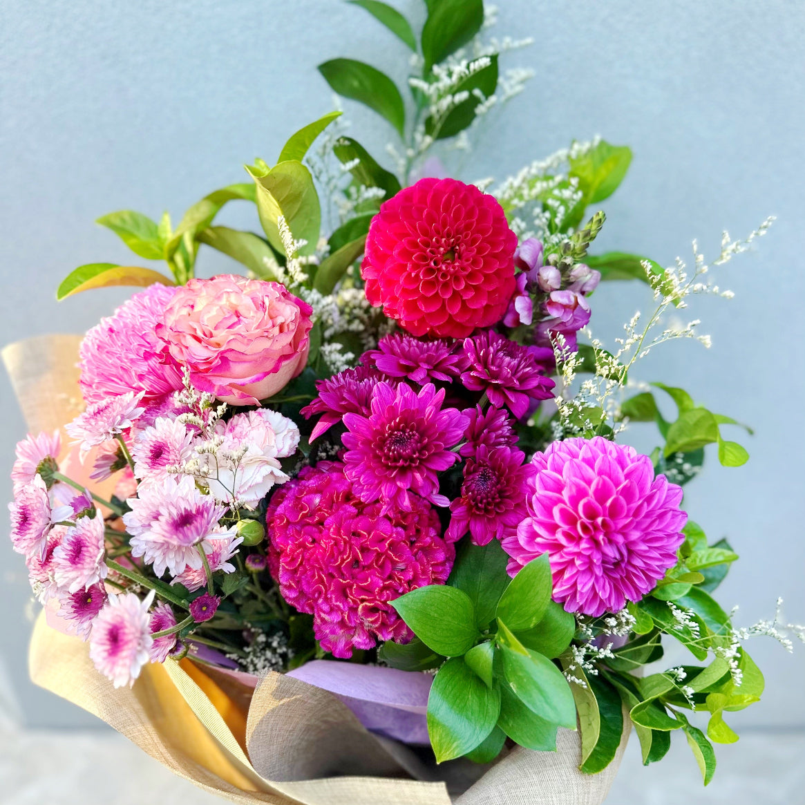 Pink dahlia and rose bouquet with garden style design
