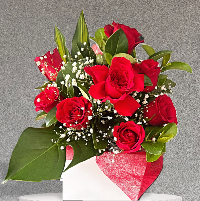 Red roses with lush greenery beautifully presented in a box. Same day flower delivery Castle Hill