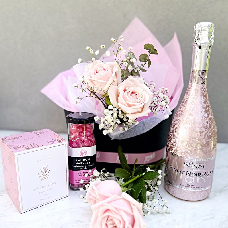 Valentines hamper with roses, procecco, candle and treats. Romantic gift ideas Sydney