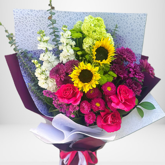 Large bright bouquet of sunflowers, roses and chrysanthemums wrapped in luxe plum paper by Bella Bloom Bar, same-day florist in West Pennant Hills | Hills District.