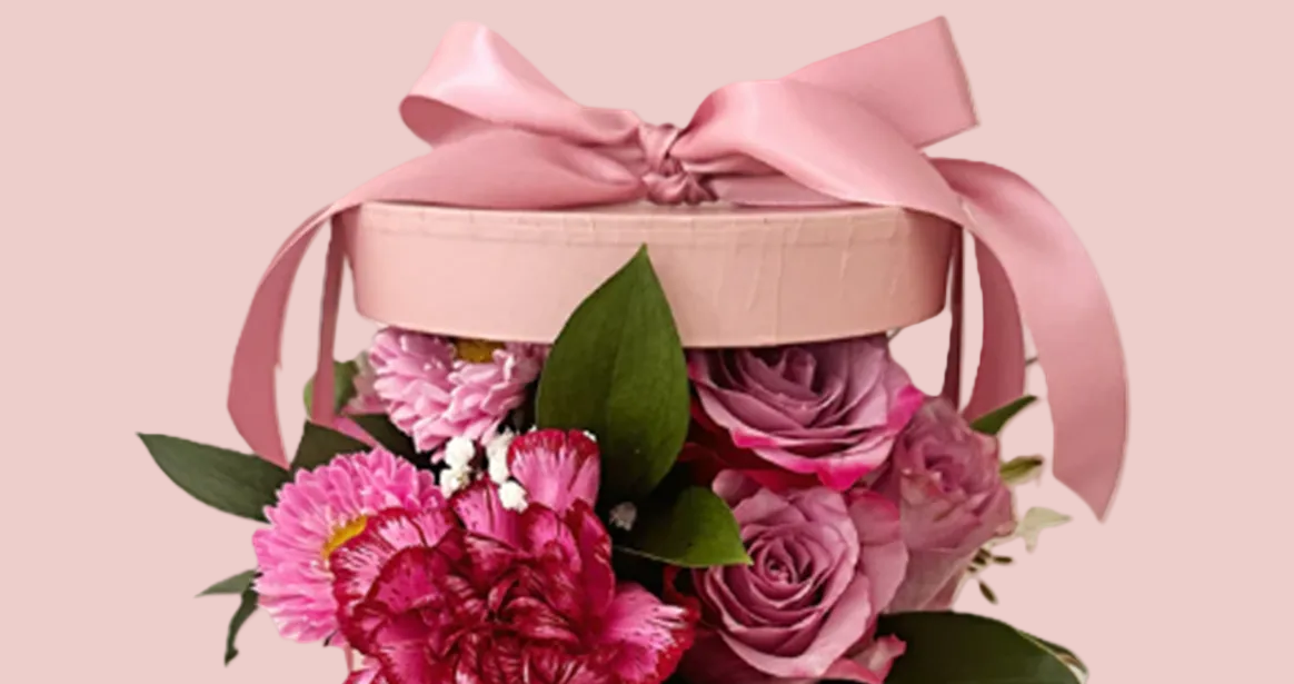 Pink floral arrangement in a decorative box with a pink ribbon Sydney flower delivery