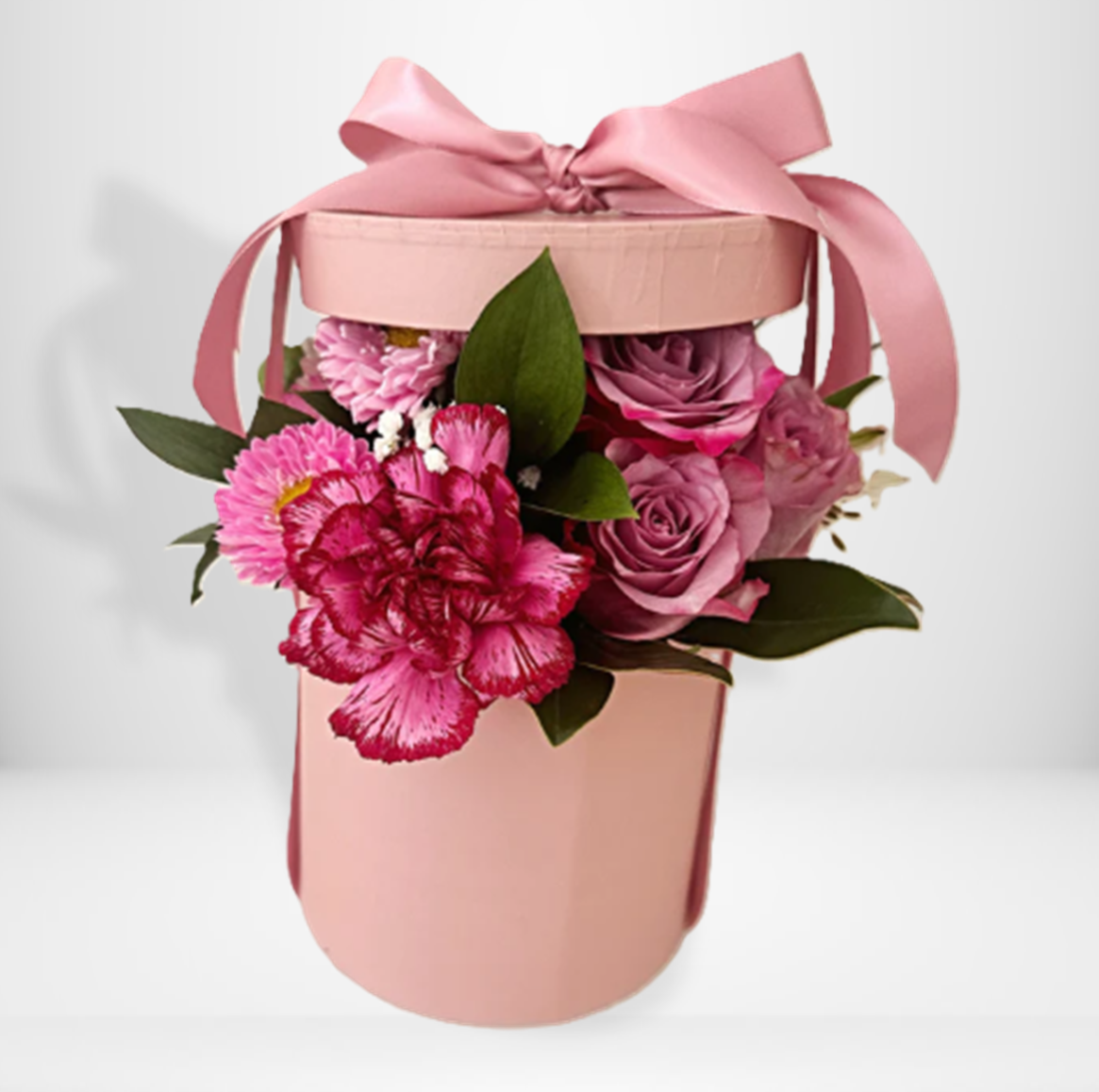 Pink floral arrangement in a pink hat box with a pink ribbon | same day flower delivery Sydney