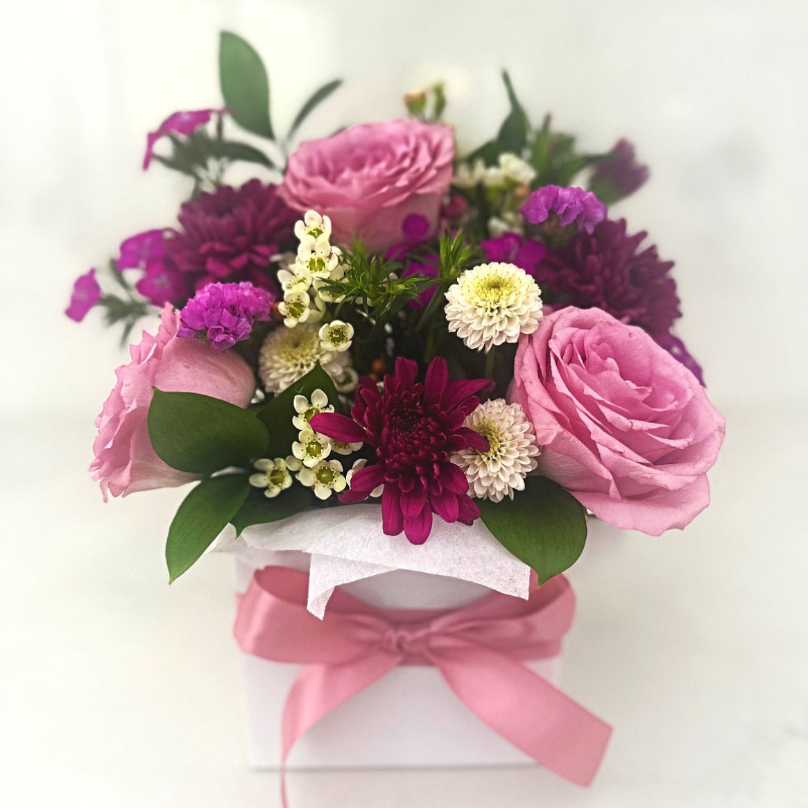 Arrangement of pink and purple roses and chrysanthemums with a pink ribbon | same day fresh flower delivery Carlingford Sydney